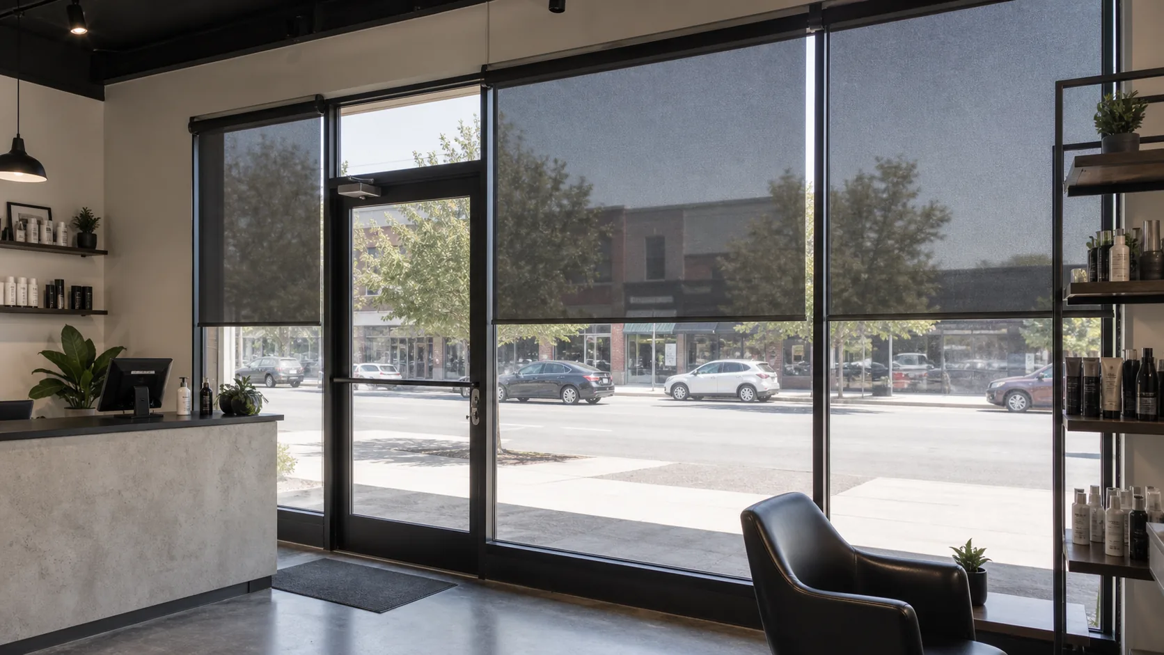 Commercial storefront windows fitted with solar roller shades