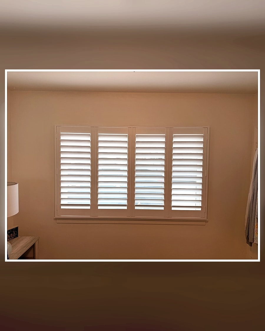 After view of white plantation shutters on a Ventura County bedroom window