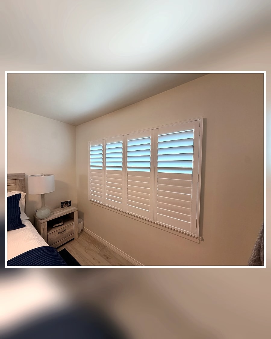 Room-angle after view of white plantation shutters in a Ventura County bedroom