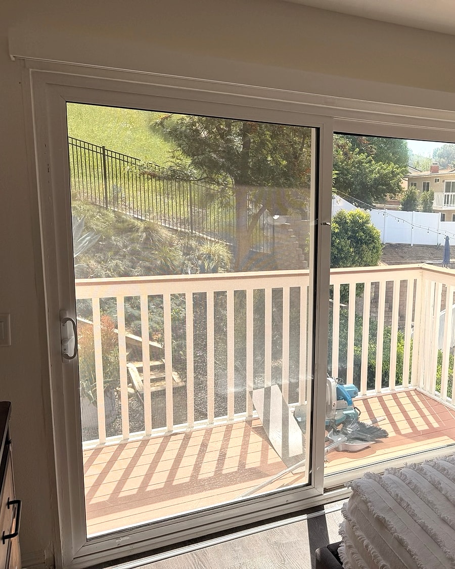 Custom shutters installed on a Ventura County bedroom sliding door