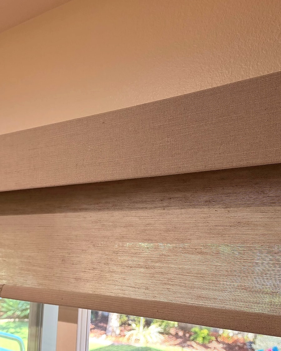 Fabric roller shade with a matching valance installed over a Ventura County window
