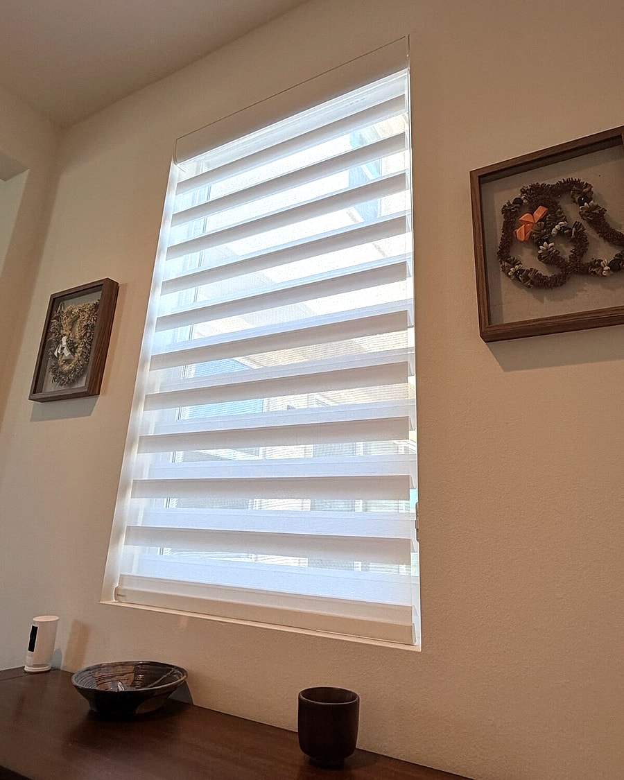 Layered window shades installed on a Ventura County bedroom window