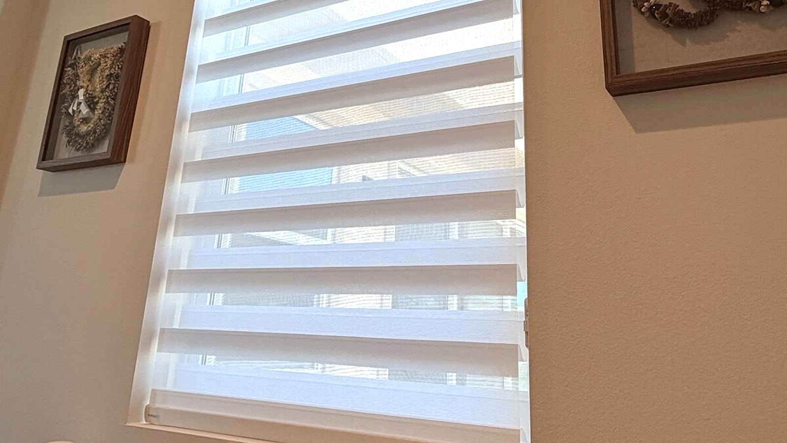 Layered window shades on a Ventura County bedroom window installed by 805 Shutters Shades and Blinds.