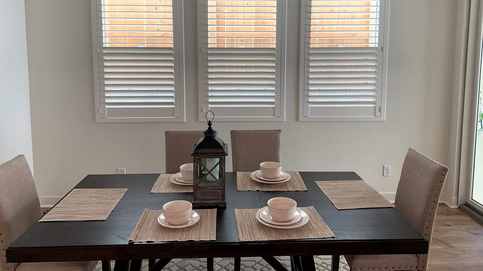 White plantation shutters installed in a Ventura County dining room