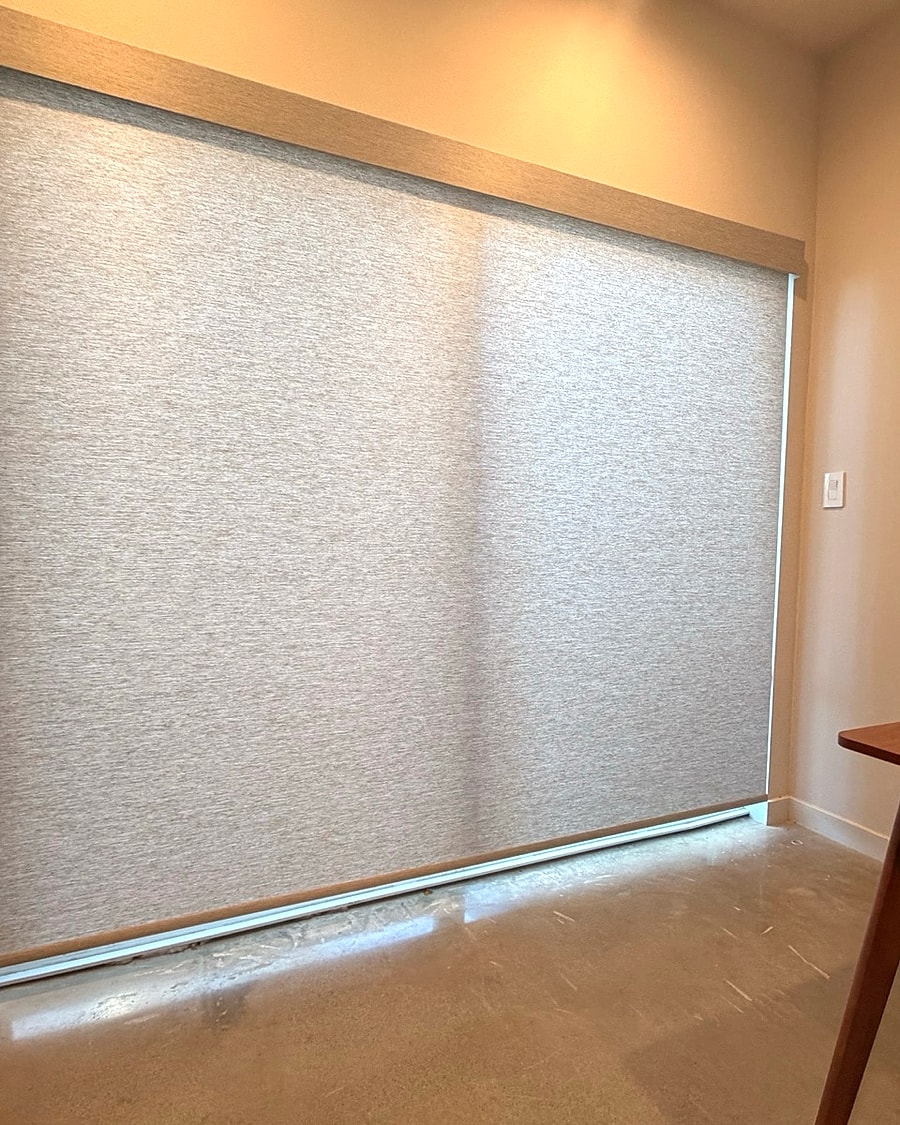 Roller shade covering a large Ventura County window