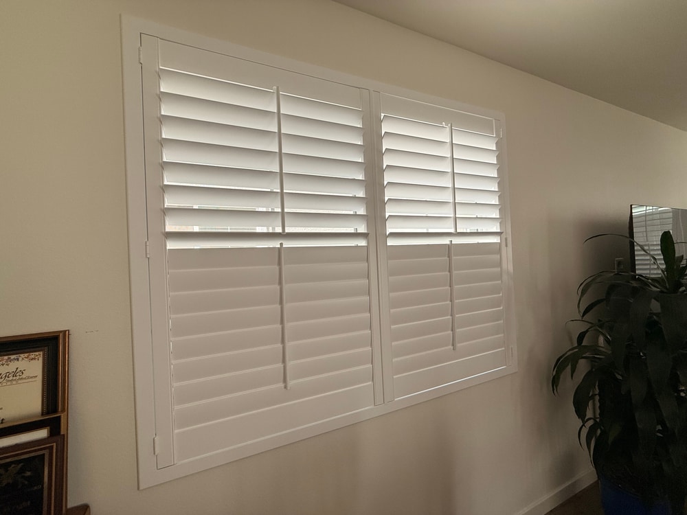 Split tilt plantation shutters showing independent upper and lower louver control