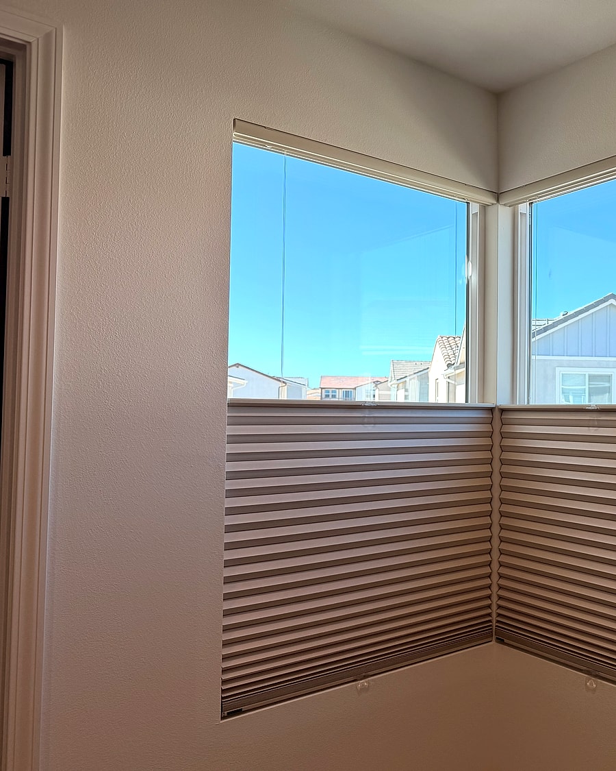 Cellular shades installed on two corner windows in a Ventura County home