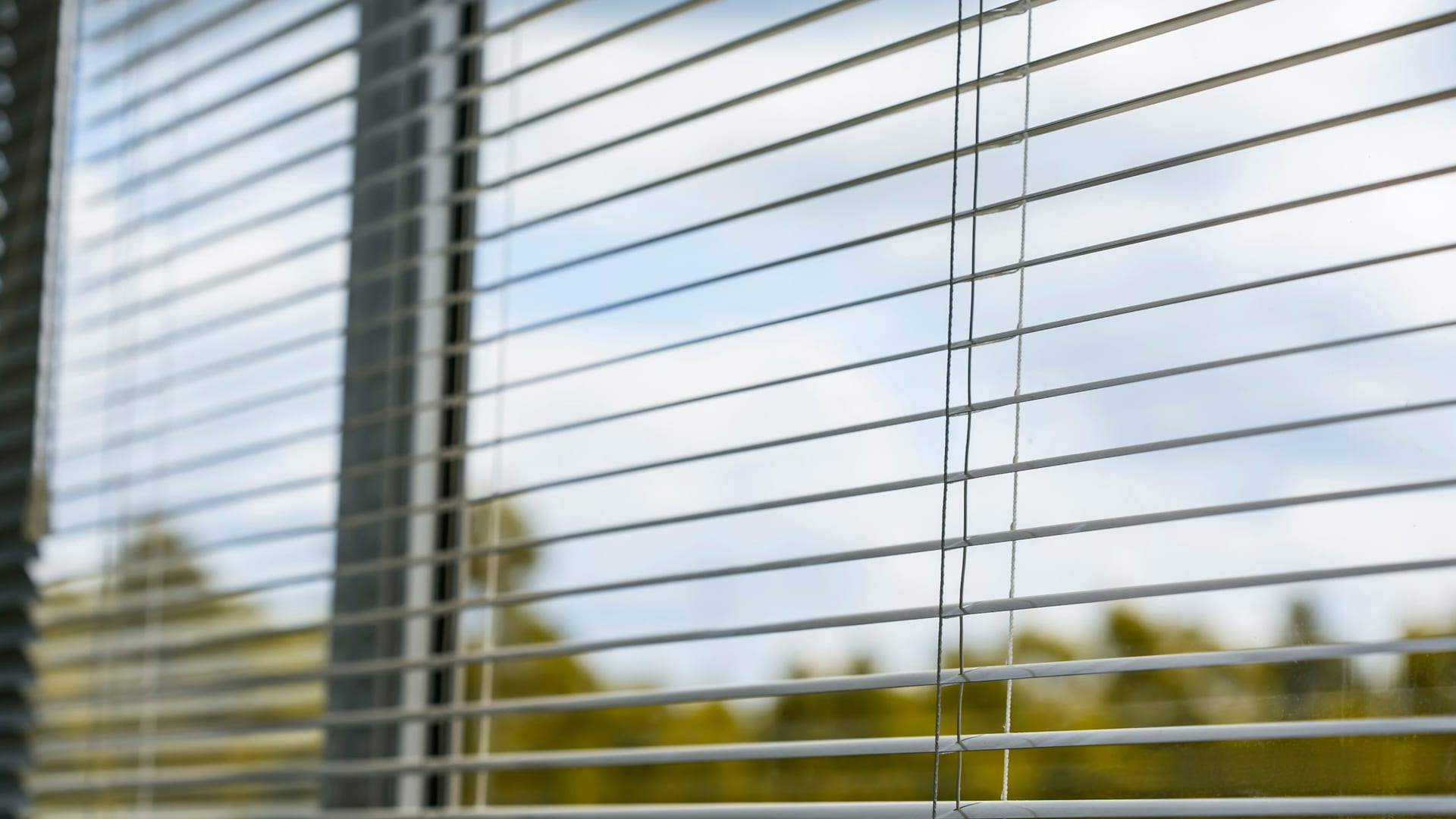 Aluminum blinds for practical light control in a Camarillo room