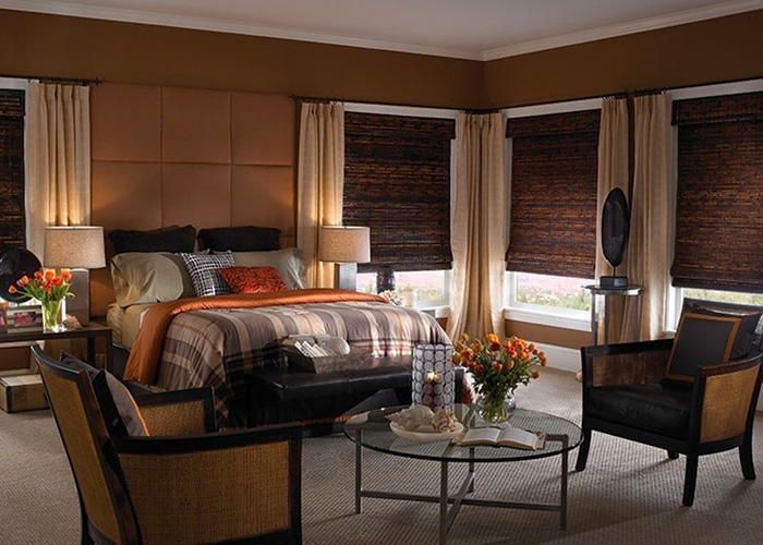 Bedroom with dark brown shades, some of our Thousand Oaks window treatments.